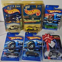 Group shot of all seven blister-pack Hot Wheels cars