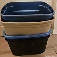 Stack of four nested plastic totes showing colors and sizes