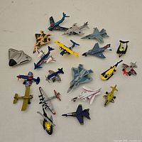 All 22 toy aircraft spread on tabletop