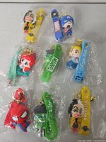 All eight sealed keychains laid out