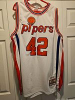 Front view showing pipers wordmark, number 42, side panels, size and tag area