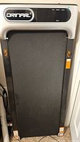 Full front view of Orinar walking pad treadmill in upright position