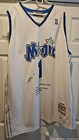 Front view of white Tracy McGrady Orlando Magic jersey on hanger