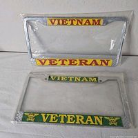 Front view of two packaged chrome Vietnam Veteran license plate frames