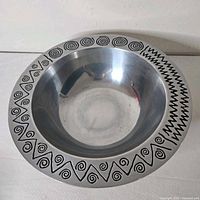 Top view of Wilton Armetale Reggae bowl showing spiral and zig-zag rim design