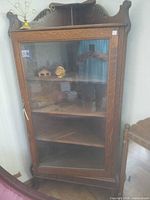 Full view of antique triangular oak corner curio cabinet