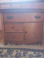 Front view of oak dresser with drawers and cabinet