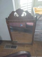 Full view of carved wood wall mirror
