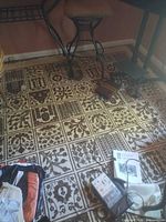 Rug shown under furniture giving overall view of pattern and coloration