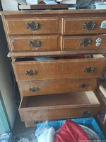 Front view of dresser with drawers partly open