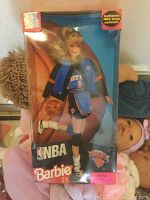 NBA Barbie doll inside original packaging wearing New York Knicks NBA uniform and holding a basketball