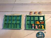 Photo of two matching Holly Hobbie wall shelving units mounted on a wall; the left unit is empty, the right unit holds various small vintage figurines, dolls, and collectibles.