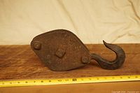 Full view of pulley hook with measuring tape showing length