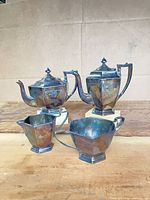 Full view of all four silver-plated pieces