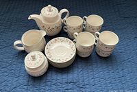 Full tea service laid out showing all 19 pieces