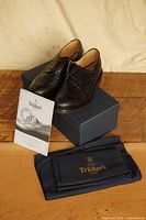 Brogues on box with leaflet and dust bag visible