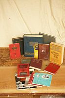 All twelve publications standing and lying flat for overall view