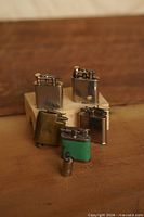 Group shot of all six lighters showing fronts and finishes