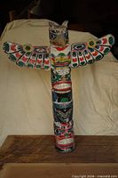 Front view showing full totem pole with wings spread