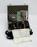 Entire kit in carry case with camera, manuals, flash, receipt visible