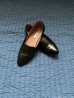 Pair of flats crossed showing uppers and labels