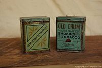 Front view showing Old Chum branding on one tin and side panel of second tin