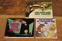 Front covers of all three Calvin and Hobbes books