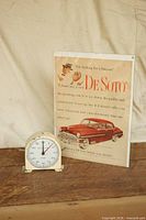 Front view showing timer and De Soto advertisement