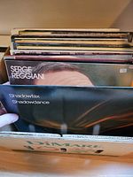 Front view of box showing several record spines and Shadowfax and Serge Reggiani sleeves