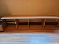 front view of three-compartment shelf showing overall structure