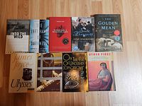 Full lot showing all ten paperback books laid out on floor
