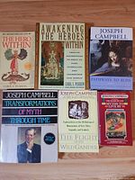 All six paperback books arranged on table