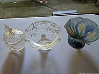 Three glass bowls: blown art glass, pressed glass, cut glass with lid