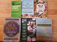 All six paperback books laid out showing fronts