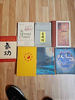 All seven books front covers visible