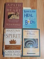 All four paperback books front covers visible