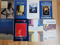 Group shot of eight paperback books showing all covers