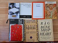 All seven books laid out front covers visible