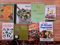 Group shot showing all eight books laid out