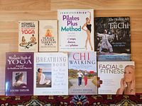 Group shot of eight of the nine paperback books showing front covers