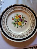 Front view of dinner plate showing floral design and border