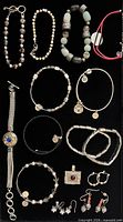 Full layout of all jewellery pieces on black background