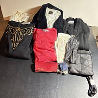 Full lot overview showing clothing, gloves, bag, tie, eyeglass case