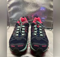Front view of both shoes showing uppers, lacing, toe condition