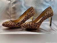 both pumps side view showing leopard print and heel
