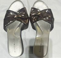Top view showing brown crossover straps and silver footbeds