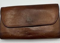 Front exterior of Rolfs leather checkbook cover showing texture and Rolfs logo