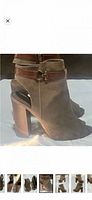 Side view of both taupe suede peep-toe ankle booties showing stacked block heel, ankle strap, side zipper