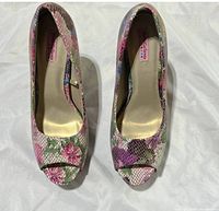 Top view of both shoes showing floral snakeskin pattern and peep toe