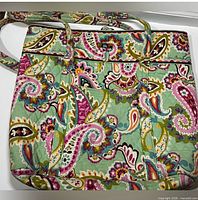 front view of tote showing exterior pattern and pockets